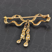 Antique Edwardian Diamond Bow Brooch in 18k Yellow Gold and Platinum