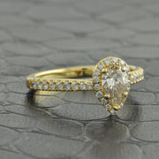 .50 ct. Pear Shape Diamond Halo Engagement Ring in Yellow Gold
