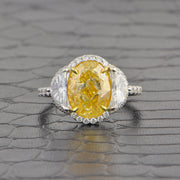 Stunning Fancy Yellow Oval Cut Diamond with Half Moon Sides