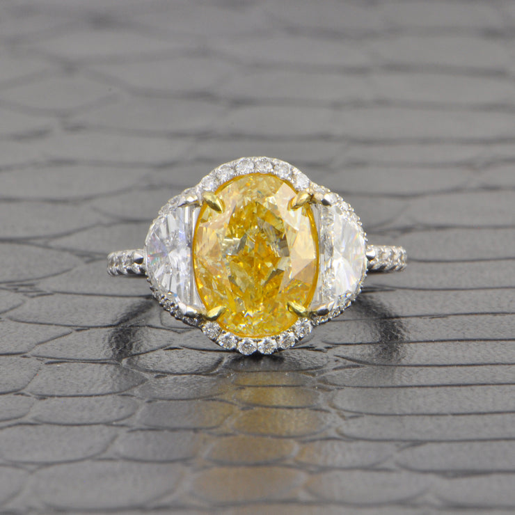 Stunning Fancy Yellow Oval Cut Diamond with Half Moon Sides