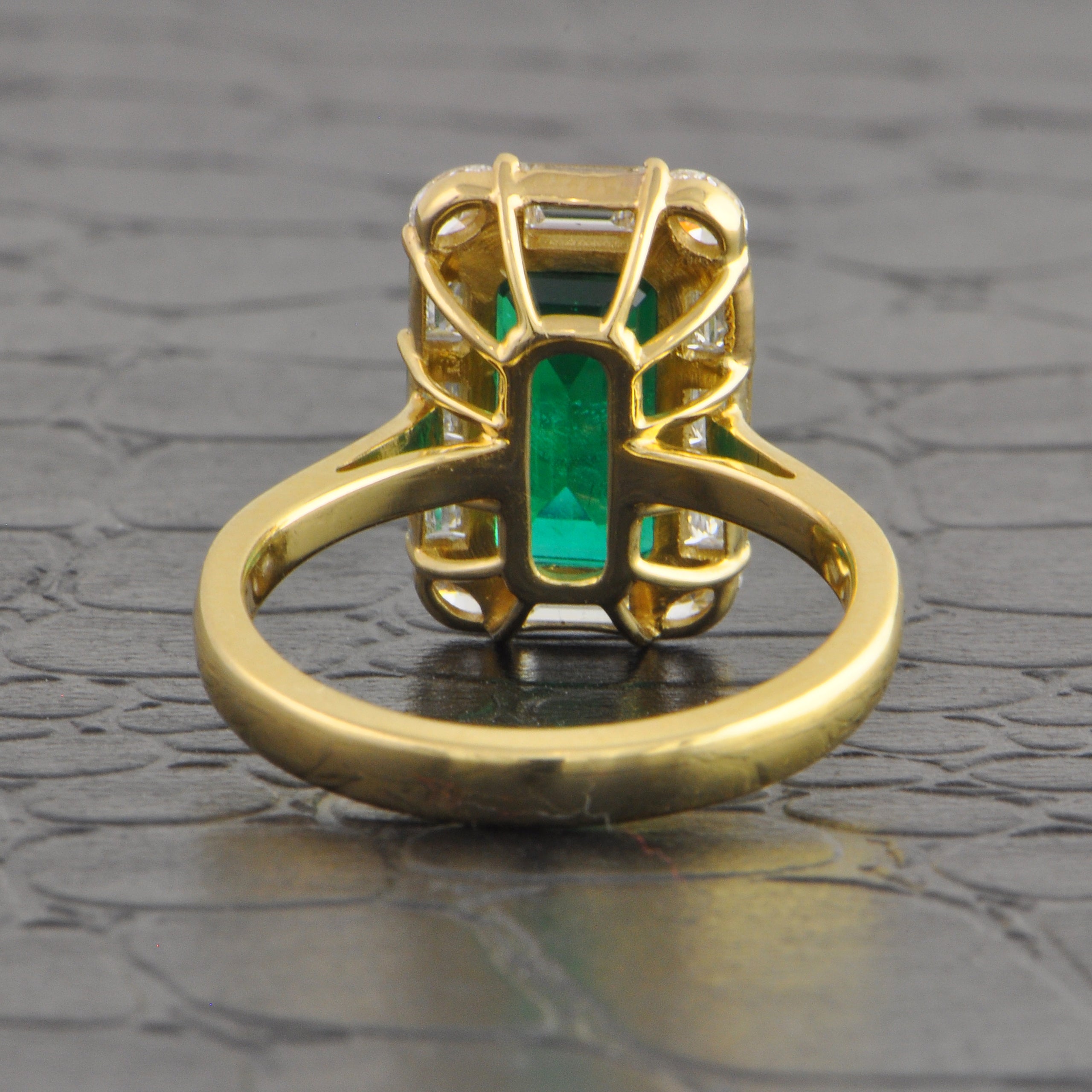 Elongated Emerald and Diamond Halo Ring in Yellow Gold