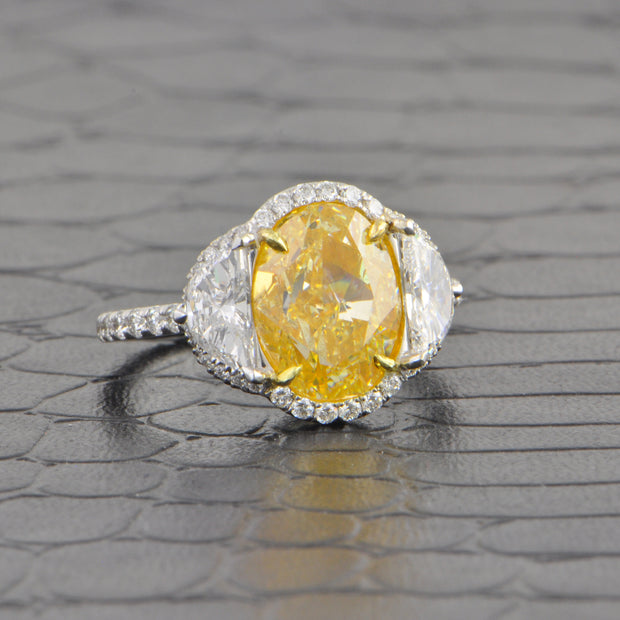 Stunning Fancy Yellow Oval Cut Diamond with Half Moon Sides