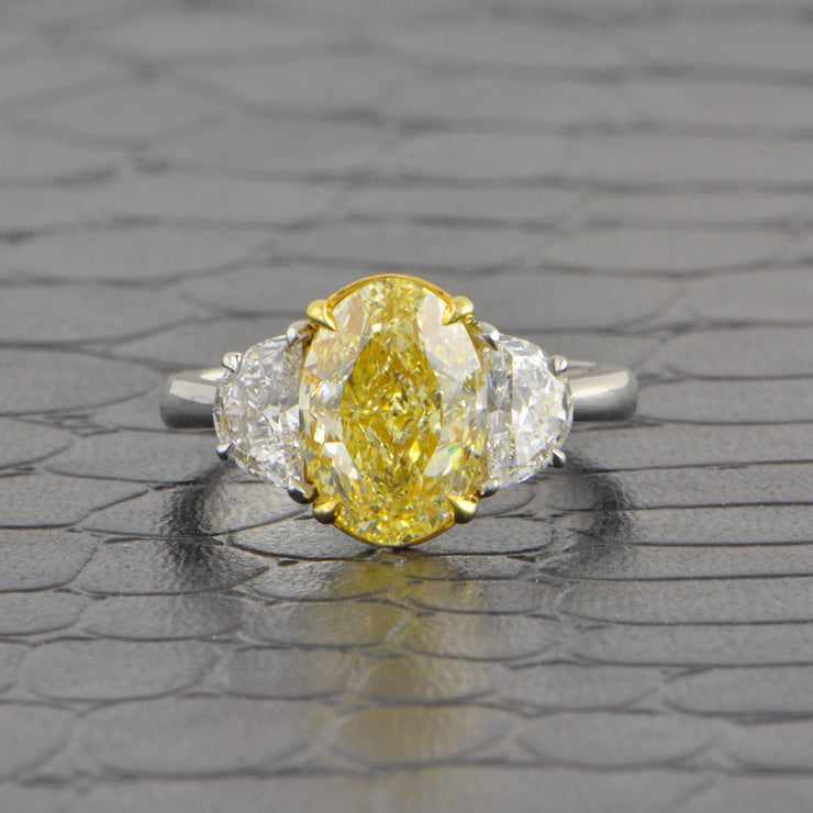 Fancy Light Yellow Oval Cut Diamond Ring in Platinum