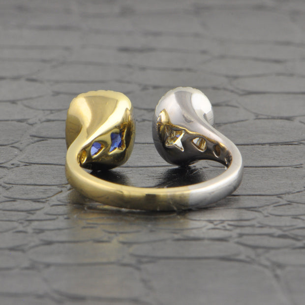 Oval Cut Diamond and Blue Sapphire Ring in Two Tone 14k Gold